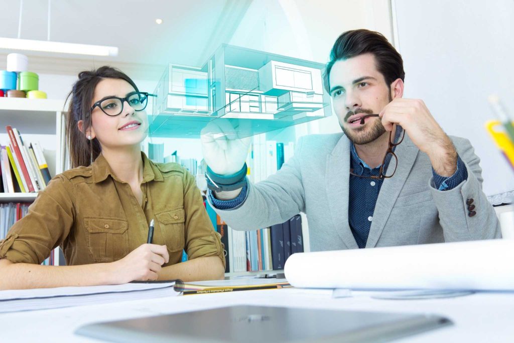 Engineers comparing In-House BIM Team vs BIM Outsourcing using BIM models for project coordination